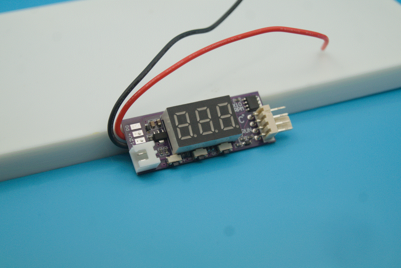 A temperature-sensing PWM Fan Speed controller on a purple PCB with a 3-digit 7-segment display.