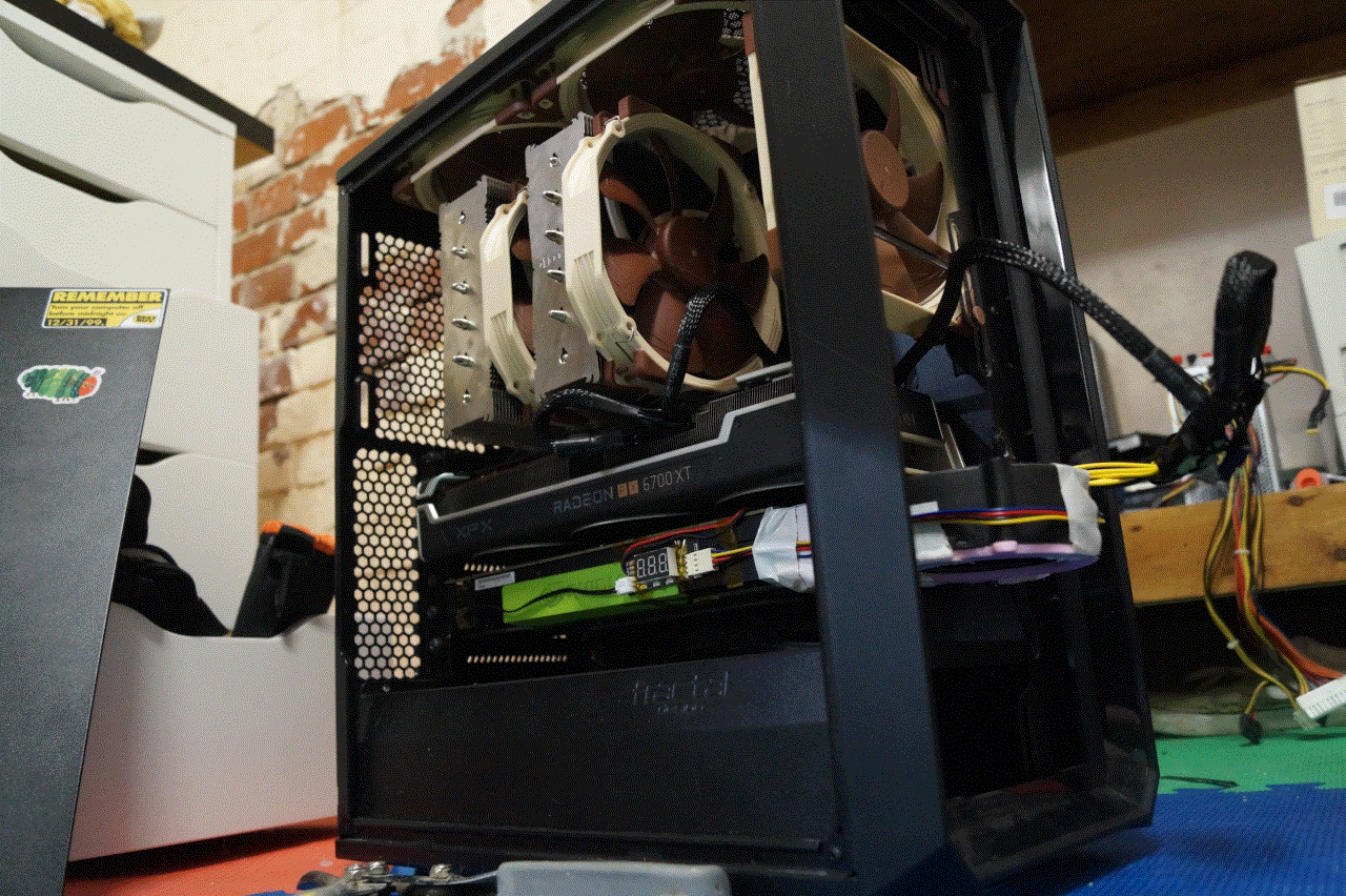 An image depicting the comically long GPU fan sticking out of a modified Fracal Terra case.